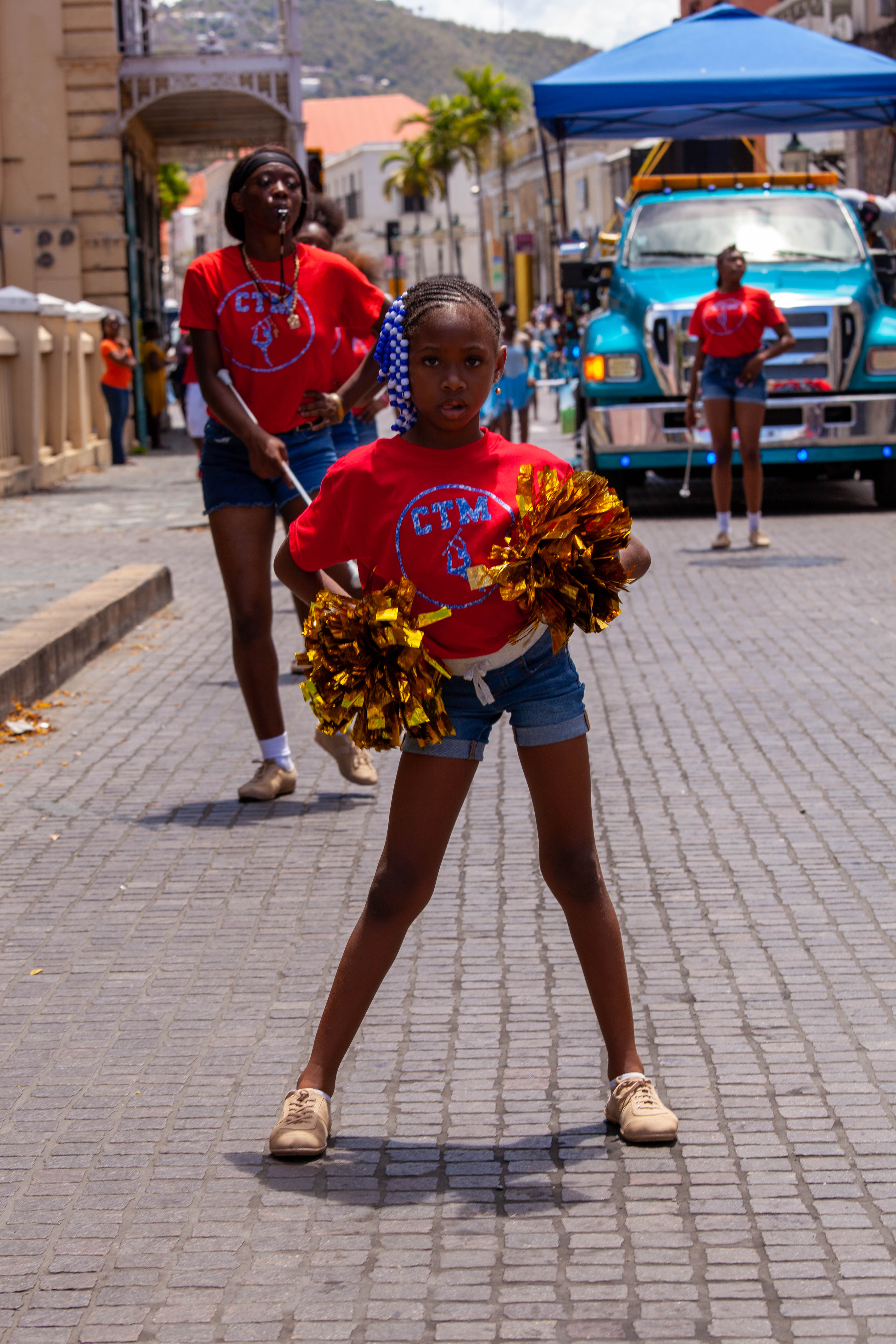 A line of Little League marchers continues through Charlotte Amalie during opening day.