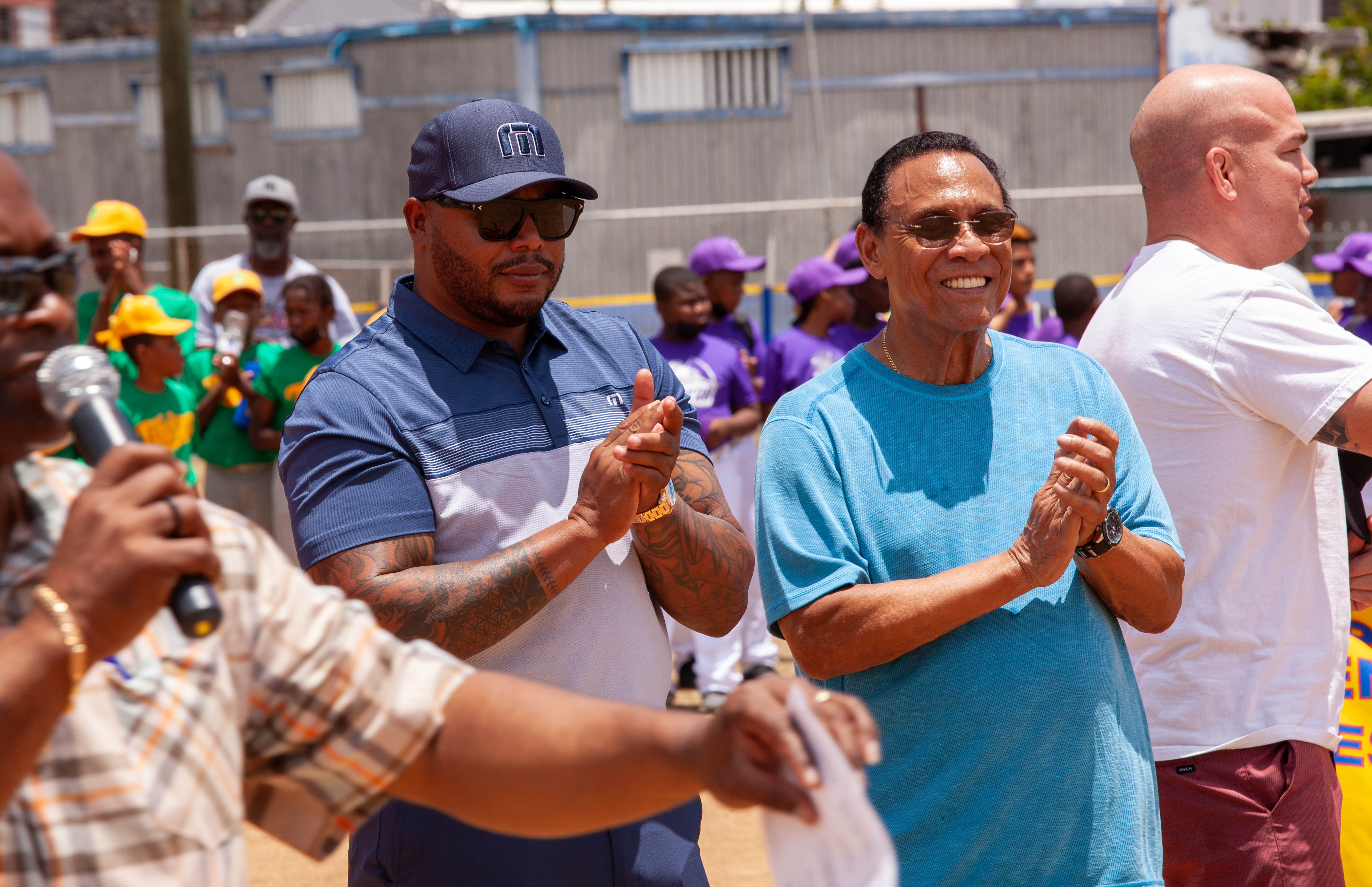 Tony Perez claps with other guests during opening ceremony remarks.